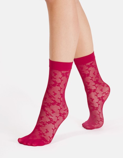 Cette - Chaussettes transparentes avec motif floral